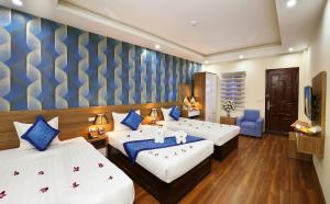 Giường trong phòng chung tại Aquarius Grand Hotel