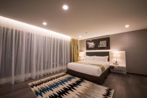 Katil atau katil-katil dalam bilik di Asiatic Hotel