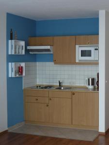 Nhà bếp/bếp nhỏ tại Fewo Binz Wohnpark Stadt Hamburg +3 ảnh