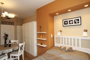 A bed or beds in a room at Orchidea Apartman Eger