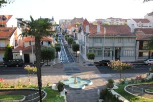 a view of a city street with buildings at Le Charme des Dunes in Arcachon