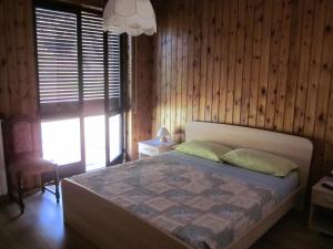 Postel nebo postele na pokoji v ubytování Agriturismo Stella Orobica