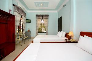 Ein Bett oder Betten in einem Zimmer der Unterkunft Dong Nguyen Riverside Homestay