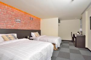 Voodi või voodid majutusasutuse Home Rest Hotel toas
