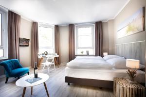 Ein Bett oder Betten in einem Zimmer der Unterkunft Hotel Liegeplatz 13 Kiel by Premiere Classe