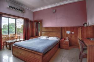 מיטה או מיטות בחדר ב-Hotel Vintage Villa