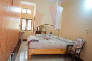 Giường trong phòng chung tại Lakshmi Heritage Tourist Home
