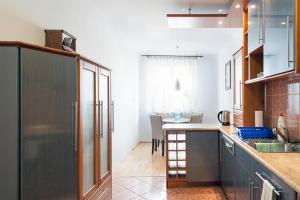 a kitchen with a sink and a counter top at DOMOTEL Aleje Jerozolimskie in Warsaw +14 photos