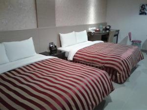 Letto o letti in una camera di Hua Xiang Motel - Arena