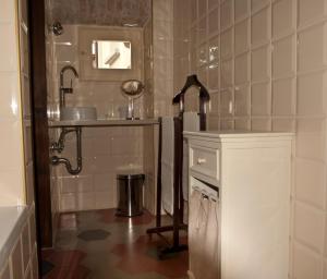 a bathroom with a sink and a mirror at Podere Pradarolo in Varano deʼ Melegari