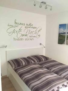 A bed or beds in a room at AAA Fewo Bad Kleinkirchheim