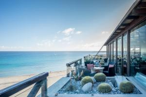a balcony with a view of the ocean at Hotel Capo San Vito by Geocharme in San Vito lo Capo