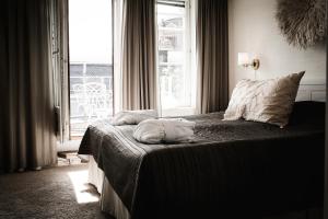 Postel nebo postele na pokoji v ubytování Freys Hotel