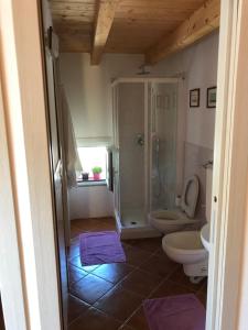 a bathroom with a shower and a toilet at Ort holiday's time in Orco Feglino +43 photos