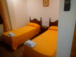 Postel nebo postele na pokoji v ubytování Hotel Restaurante Calderon