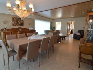 a dining room with a table and chairs at Spacious holiday home in Ruiselede with a garden in Ruiselede