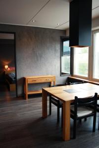 a dining room with a table and chairs and a bedroom at Apartment in Jakobstad / Pietarsaari in Pietarsaari