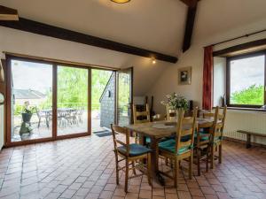 A balcony or terrace at Spacious Farmhouse in Fontenelle with Garden