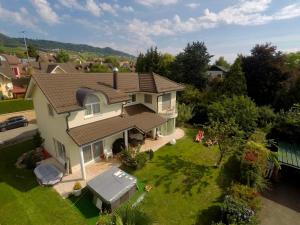 an overhead view of a house with a yard at Chambre D'Hôtes Wellingtonia in Mont-sur-Rolle