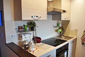 a small kitchen with a sink and a counter at Tigullio Vacations: lo Chalet sul Mare in Leivi