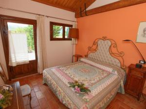 A bed or beds in a room at Detached house in Cagli with swimming pool and garden