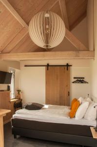 En eller flere senge i et værelse på Bed & Breakfast Bed in Brabant Veghel
