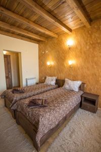 Tempat tidur dalam kamar di Rupchini Houses