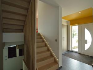 a staircase in a house with wood treads at Holiday Home in Malmedy with Indoor Heated Pool in Malmedy