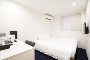 Voodi või voodid majutusasutuse CVS Bay Hotel New Building toas
