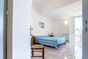 Un pat sau paturi într-o cameră la La Panoramica