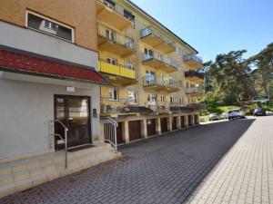 an empty street in front of a building at Apartament Na Wydmie - parter in Ustka +4 photos