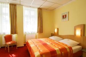 Postel nebo postele na pokoji v ubytování Johanniterhotel