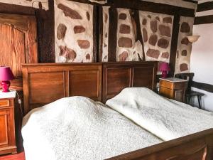Postel nebo postele na pokoji v ubytování Chambre d'Hôtes chez Nadine Hamm