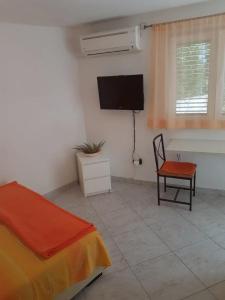 Postel nebo postele na pokoji v ubytování Apartmani Božana Viganj