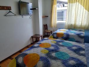 Postel nebo postele na pokoji v ubytování Hotel Ventura
