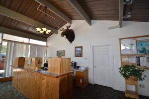 an office with a desk and a counter in a room at Dude & Roundup in West Yellowstone