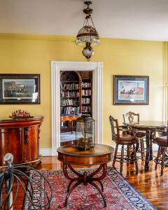 a room with a table and chairs and a dining room at The Swope Manor Bed & Breakfast in Gettysburg