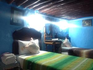 Postelja oz. postelje v sobi nastanitve Hotel Riad Dalia Tetouan