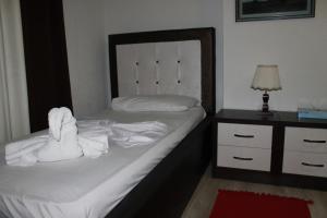 Postel nebo postele na pokoji v ubytování Hotel Livia
