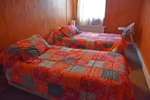 Uma cama ou camas num quarto em Cabañas Patagonia Insitu
