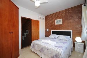 Ένα ή περισσότερα κρεβάτια σε δωμάτιο στο Ecco House Buzios +38 φωτογραφίες