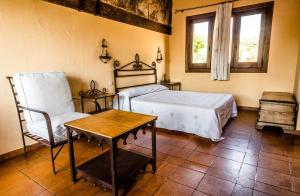 Cama o camas de una habitación en Hotel Rural Hosteria Fontivieja