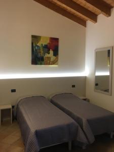Postel nebo postele na pokoji v ubytování Villa Pasini