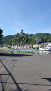 a view of a town with a castle on a hill at Haus Christiane in Cochem