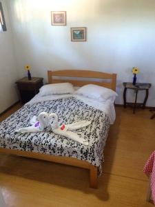 מיטה או מיטות בחדר ב-Pousada Manu