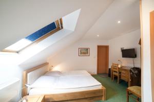a bedroom with a bed and a desk at Pelikan in Aleksandrów Łódzki +37 photos