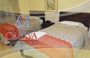 Voodi või voodid majutusasutuse Hotel Caluva toas
