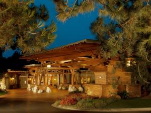 a resort with a wooden building at night at The Lodge at Torrey Pines in San Diego