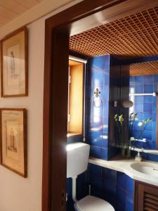 a bathroom with a toilet and a sink at CASA DO LARGO DO COLÉGIO in Évora