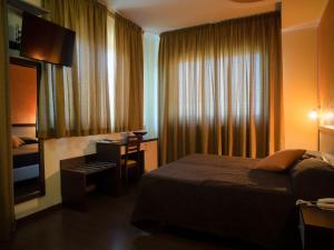 Postel nebo postele na pokoji v ubytování Hotel Select + 37 fotografií